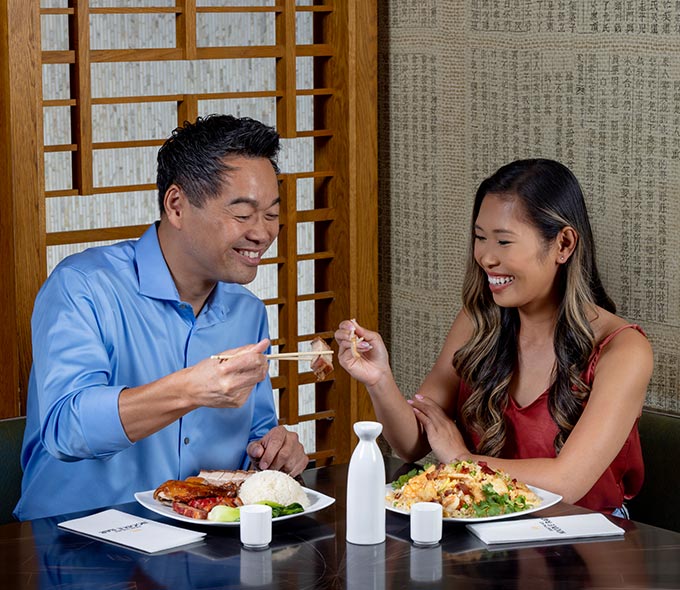 Couple dining at Jubao Palace Noodle Bar
