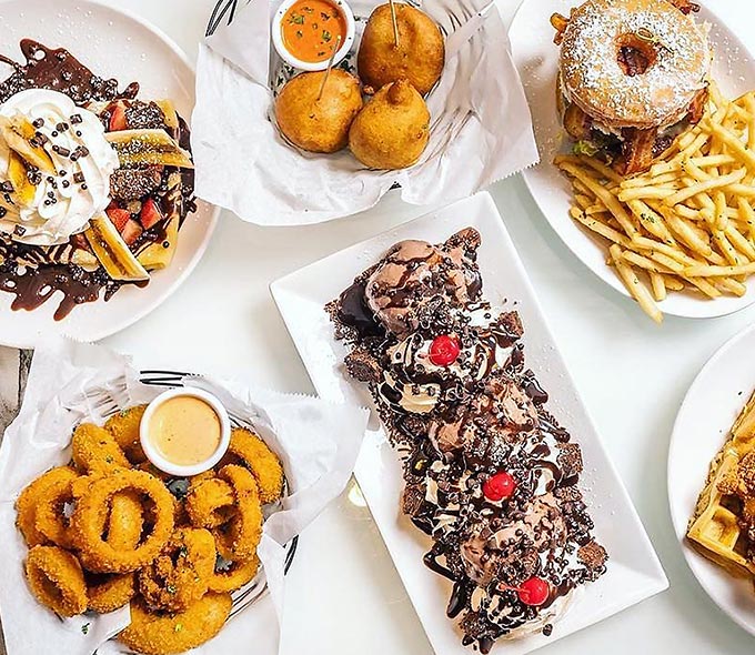 Overhead View of Numerous Plates of Food on a Table at the Sugar Factory